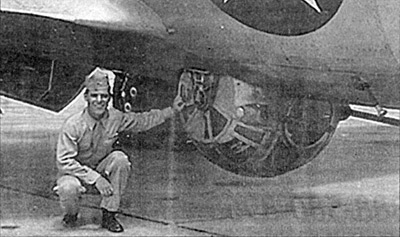 Larry Hilte next to a Sperry Ball Turret during World War 2
