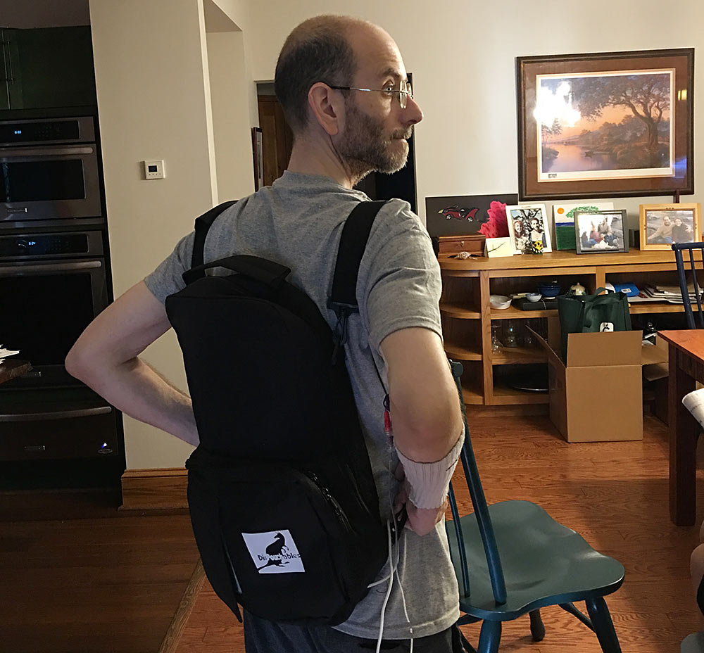 Elliot models the new plus-size TPN backpack
